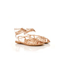 Rose gold sandal on a white background