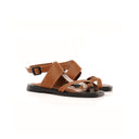 Brown sandal with black sole on a white background