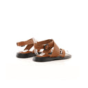 Brown sandals with straps on a white background